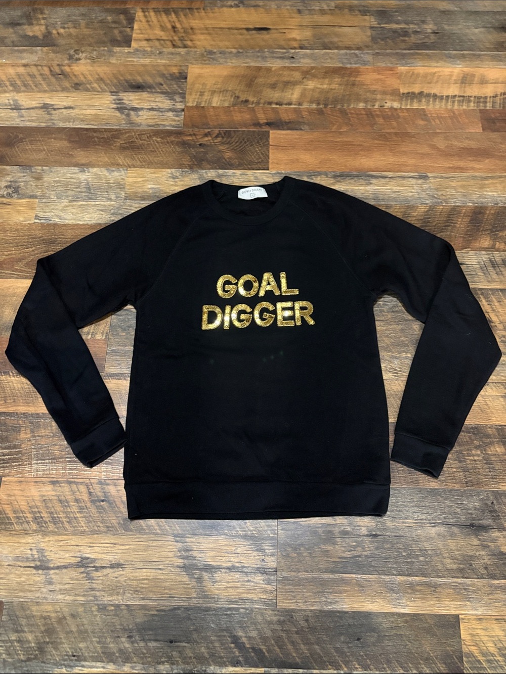Bow & Drape crewneck sweatshirt featuring the phrase "GOAL DIGGER"